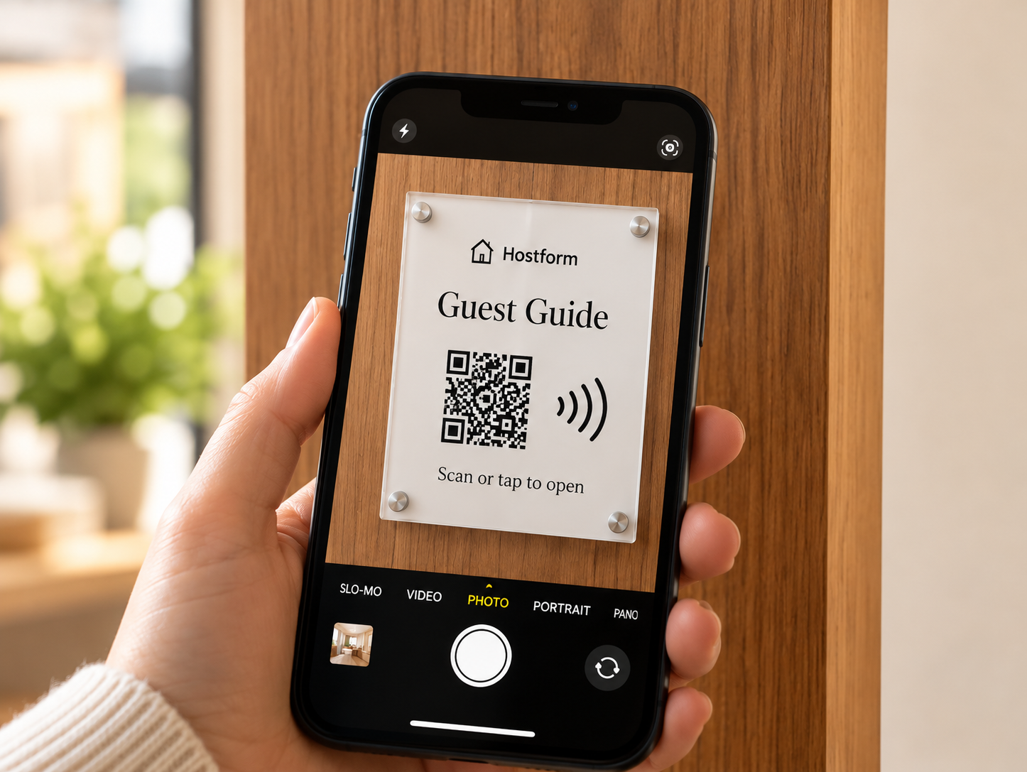 Guest scanning Hostform QR signage
